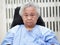 Asian senior or elderly old lady woman patient smile bright face while sitting on wheelchair in nursing hospital ward