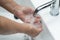 Asian senior elderly old lady woman patient washing hands in toilet bathroom the hospital ward, healthy medical concept