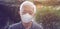 Asian senior elderly wearing mask thinking worry stress and bored with pandemic never ending