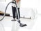 Asian senior elderly woman housewife vacuuming the floor at bedroom with vacuum cleaner, grandma doing housework at house