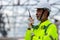 Asian senior engineer technician watching construction control in the construction of roof structures on construction site an