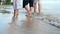 Asian senior love couple with son travel on the beach. Retirement age family relaxing and recreation on summer holiday