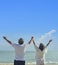 Asian senior love couple travel on the beach. Retirement age family relaxing and recreation on summer