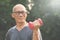 Asian Senior man lifting dumbbell