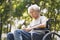 Asian senior man sitting in wheelchair