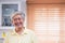 Asian senior man smile in living room at home,Happy aging at home concept