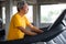 asian Senior man walking exercise on treadmill workout in fitness gym . sport , trainnig , retired , older , mature, elderly