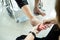 Asian senior mother in wheelchair,receiving a foot massage from her daughter,physiology pressing with fingers to relax,old woman