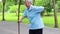 Asian senior woman with back and hip joint painful while walking exercise,female patient have backache,lumbago pain,hand touch on