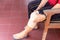 Asian senior woman with bandage compression knee brace support injury.