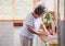 Asian senior woman cleaning a sink with rag in the kitchen ,Happy aging at home concept