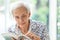 Asian senior woman reading a book relaxed at home,elderly woman spend their free time reading book