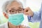 Asian senior woman suffer from cough with face mask protection,elderly woman wearing face mask because of air pollution,Sick old