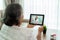 Asian senior woman using video conference, make online consultation with pharmacy consulting about illness and medication via