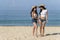 Asian Sexy young girls smiling wearing straw hat and sunglass, walking at the beach, travel of summer vacation. Relaxation and