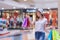 Asian shopping woman holding credit or debit card and shopping bags at shopping mall. Consumerism, sale and people online concept