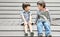 Asian sibling sitting together with smile