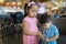 Asian siblings looks adorable having drinks at a local coffee shop stock photo