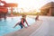 Asian siblings in playing together in Water Aqua park pool