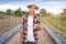 Asian smart farmer holding tablet in his organic farm. Technology and agriculture concept