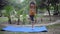 Asian smart kid doing yoga pose in the society park outdoor, Children\'s yoga pose. The little boy doing Yoga and meditation