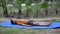 Asian smart kid doing yoga pose in the society park outdoor, Children\'s yoga pose. The little boy doing Yoga and meditation