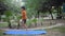 Asian smart kid doing yoga pose in the society park outdoor, Children\'s yoga pose. The little boy doing Yoga and meditation