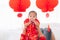 Asian smart young father play together with his son adorable baby  healthy family in red Chinese costume spent time together in