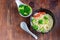 Asian soup with wheat noodles, slices of meat, red chili peppers.