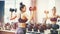 Asian sports woman doing exercises with dumbbell weights in gym