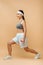 Asian sportswoman with dumbbells doing lunges