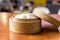 Asian steam bun bao in a bamboo steamer