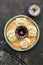 Asian steam manti dumplings with soy sauce and sesame seeds on a black concrete background.Top view , flat lay . ASIAN FOOD.