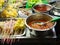 Asian street Food. People cooking, selling and buying Exotic Asian Food