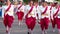 Asian street parade. Rows of beautiful Thai women in traditional dress