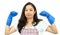 Asian strong girl posing with cleaning glove and apron on white