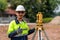 Asian Surveyor Civil Engineer thumbs up with equipment on the construction site