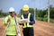 Asian surveyor engineer two people checking level of soil with Surveyor\\\'s Telescope equipment to measure leveling