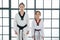 Asian Taekwondo teacher and student woman and girl stand for prepare of  saluting in Taekwondo general posture