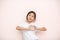 Asian tanned skin girl child portrait over pink wall background, valentine day concept.