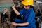 Asian technician or turner girl use the screw  machine to drill the product in the workplace