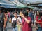 Asian teen friends walking and eating some food and drinking fruit juice