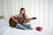 Asian teen playing guitar relax in bedroom, enjoy leisure weekend at home. Stress free concept