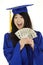 Asian teenage in blue graduation gown holding US money