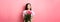 Asian teenage girl in cute dress looking romantic at empty space logo, holding valentines day flowers gift, receive