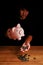 Asian teenager hold piggy bank to take coins out, saving cash coin concept investment. Management growth funding budget for wealth