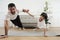 Asian Thai father and son practice yoga on living room floor together.Asian Thai father and son practice yoga on living room floor