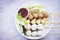 Asian Thai food grilled meatballs fishball and porkball with spicy sauce, Meatballs on skewers on white plate and fresh vegetables