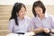 Asian Thai high schoolgirls student couple in school studying