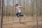 Asian Thai man in white casual stands alone in dry pie forest